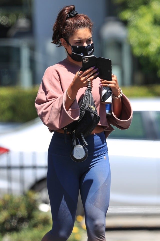 Vanessa Hudgens checks her phone