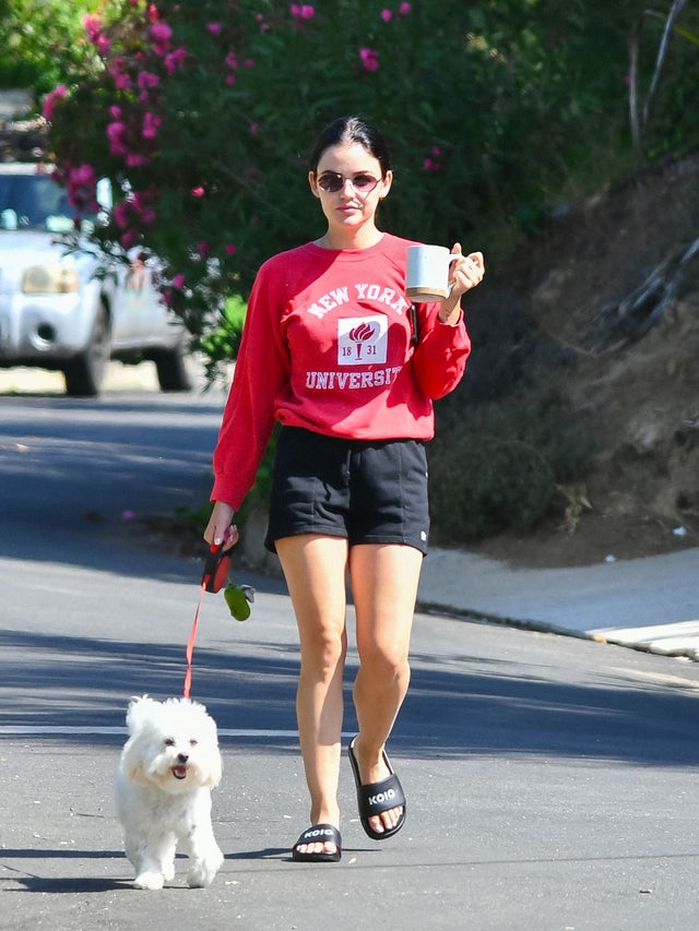 lucy hale with dog and coffee