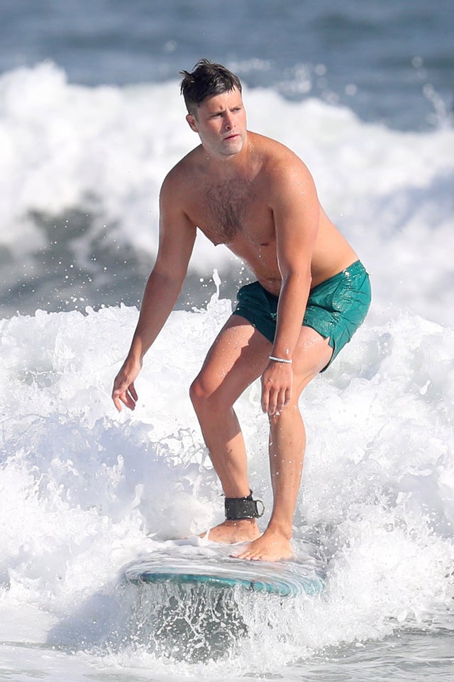 Colin Jost surfing in the hamptons