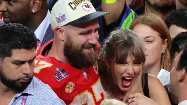 Travis Kelce #87 of the Kansas City Chiefs celebrates with Taylor Swift after defeating the San Francisco 49ers 25-22 in overtime during Super Bowl LVIII at Allegiant Stadium on February 11, 2024 in Las Vegas, Nevada.