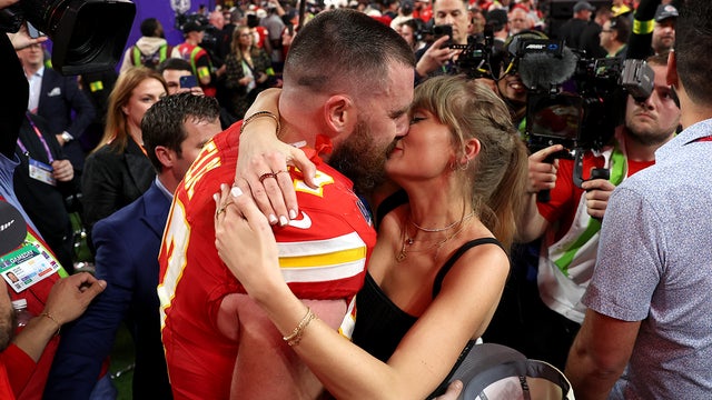 Travis Kelce #87 of the Kansas City Chiefs and Taylor Swift embrace after defeating the San Francisco 49ers in overtime during Super Bowl LVIII at Allegiant Stadium on Feb. 11, 2024 in Las Vegas, Nevada. 