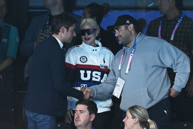 Lady Gaga and fiance Michael Polansky meet France's Prime Minister Gabriel Attal at the swimming event during the Paris 2024 Olympic Games at the Paris La Defense Arena in Nanterre, west of Paris, on July 28, 2024