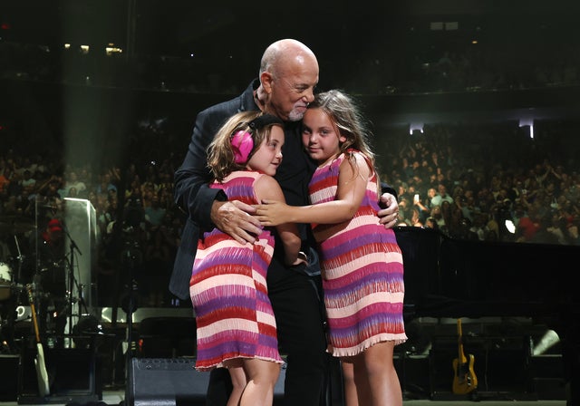 Billy Joel was joined on stage by his daughters -- Della, 8, and Remy, 6 -- for his final performance at Madison Square Garden on July 25, 2024.