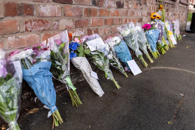 Floral tributes near the scene in Hart Street, Southport, where two children died and nine were injured in a "ferocious" knife attack during a Taylor Swift event at a dance school on Monday. A 17-year-old male from Banks, Lancashire, has been arrested on suspicion of murder and attempted murder over the incident. Picture date: Tuesday July 30, 2024.