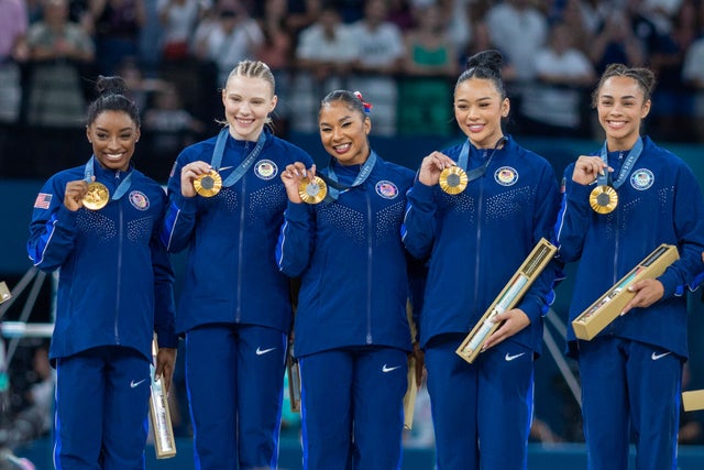 The United States team of Simone Biles, Jade Carey, Jordan Chiles, Sunisa Lee, and Hezly Rivera on the podium with their gold medals after the team's victory during the Artistic Gymnastics Team Final for Women at the Bercy Arena during the Paris 2024 Summer Olympic Games on July 30th, 2024 in Paris, France.