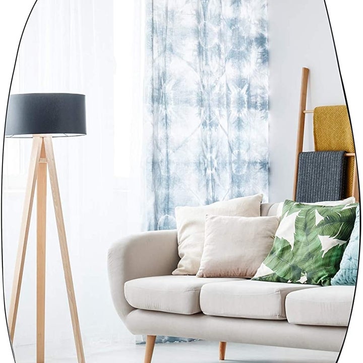 https://www.etonline.com/sites/default/files/styles/720x720/public/images/2021-07/EDGEWOOD%20Asymmetrical%20Accent%20Wall%20Mounted%20Mirror.jpg?h=a404172c