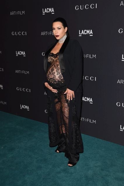 Kylie Jenner bares bump in sheer lace jumpsuit at NYFW