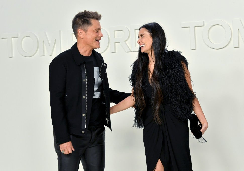 Demi Moore And Rob Lowe Share A Kiss At Fashion Show