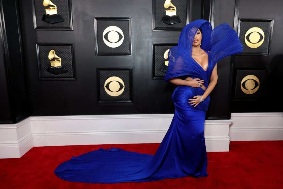 Cardi B Hits The 2023 GRAMMYs Red Carpet In Dramatic Hooded Cutout Gown ...