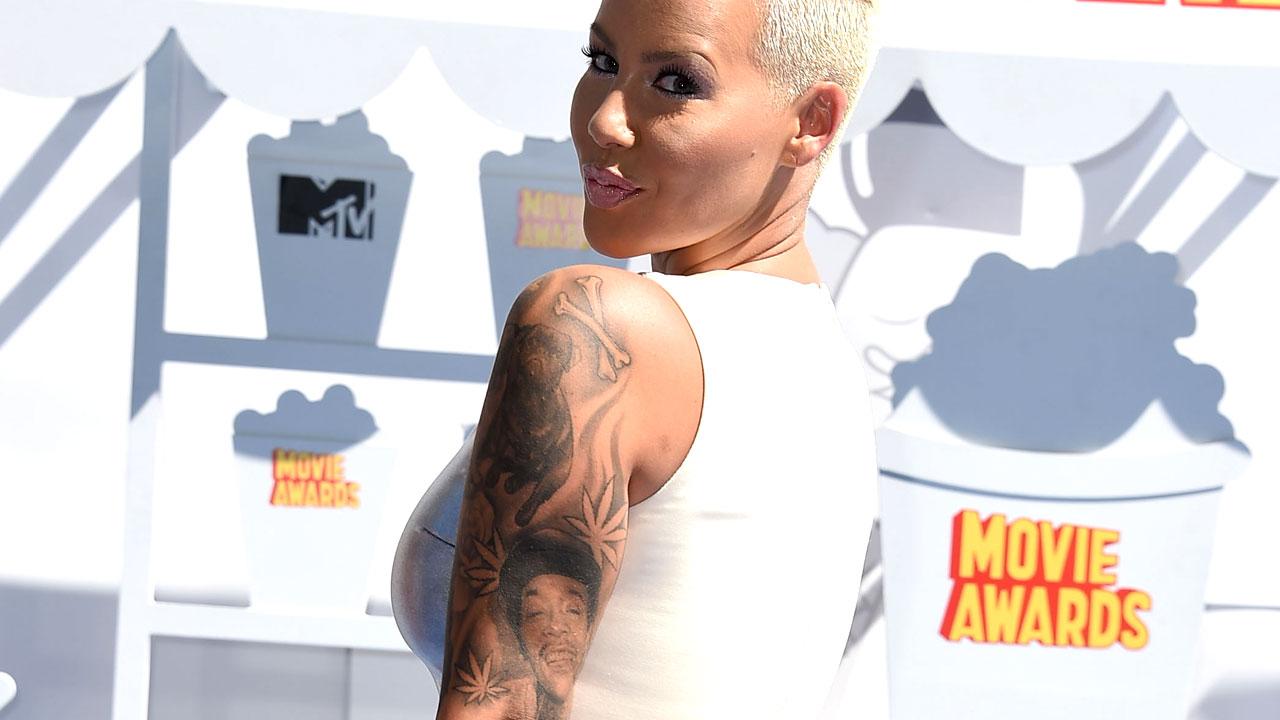 Amber Rose Officially Covers Wiz Khalifa Tattoo With Portrait of Another Man