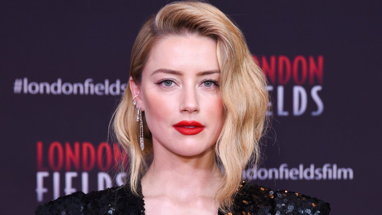 Amber Heard Was Sold On Aquaman At The Empowering Chance To Wield A Sword And A Crown Exclusive Entertainment Tonight