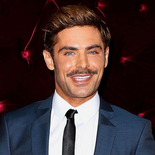 Zac Efron causes a fan frenzy as he pays a visit to the BBC studios for an  interview earlier today. The actor, who has recently grown a beard and  moustache, wore aviator