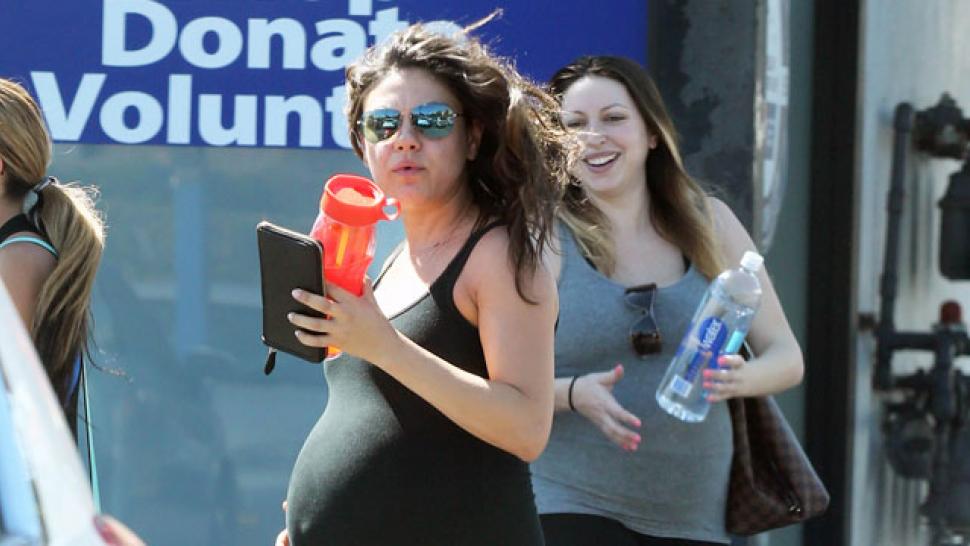 Pregnant Mila Kunis Brings Huge Baby Bump to Dodgers Game with