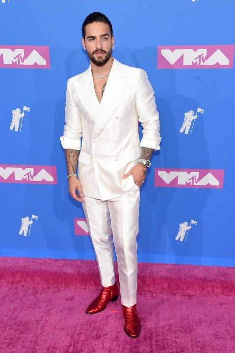 Maluma, wearing a black Off-White printed t-shirt, white sporty pants  News Photo - Getty Images