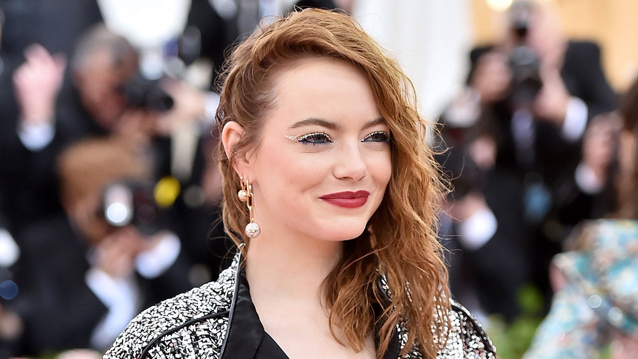 Emma Stone wears a daring thigh-split plunging gown at the Met Gala