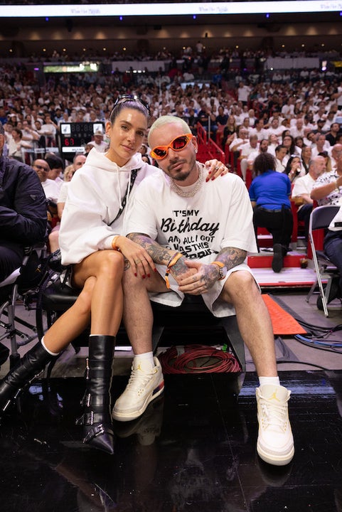 Bad Bunny sits courtside for the game between the Charlotte