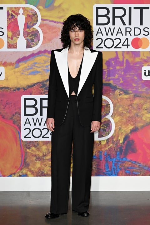 BRIT Awards 2024: Ellie Goulding ditches the bra and bares her abs in an  elegant rose gold gown as she hits the red carpet - after confirming new  romance with Armando Perez