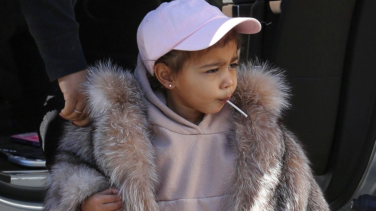 Kim Kardashian and Kanye West attacked for dressing North in a fur coat