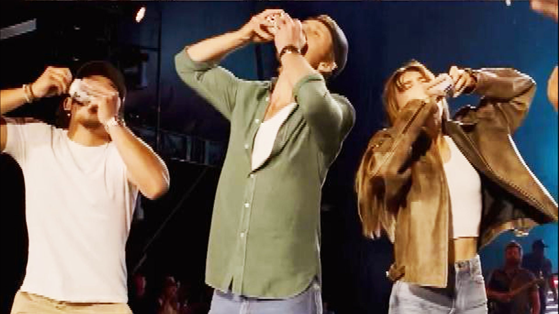 Glen Powell and ‘Twisters’ Cast Shotgun Beers With Luke Combs as Movie Hits No. 1