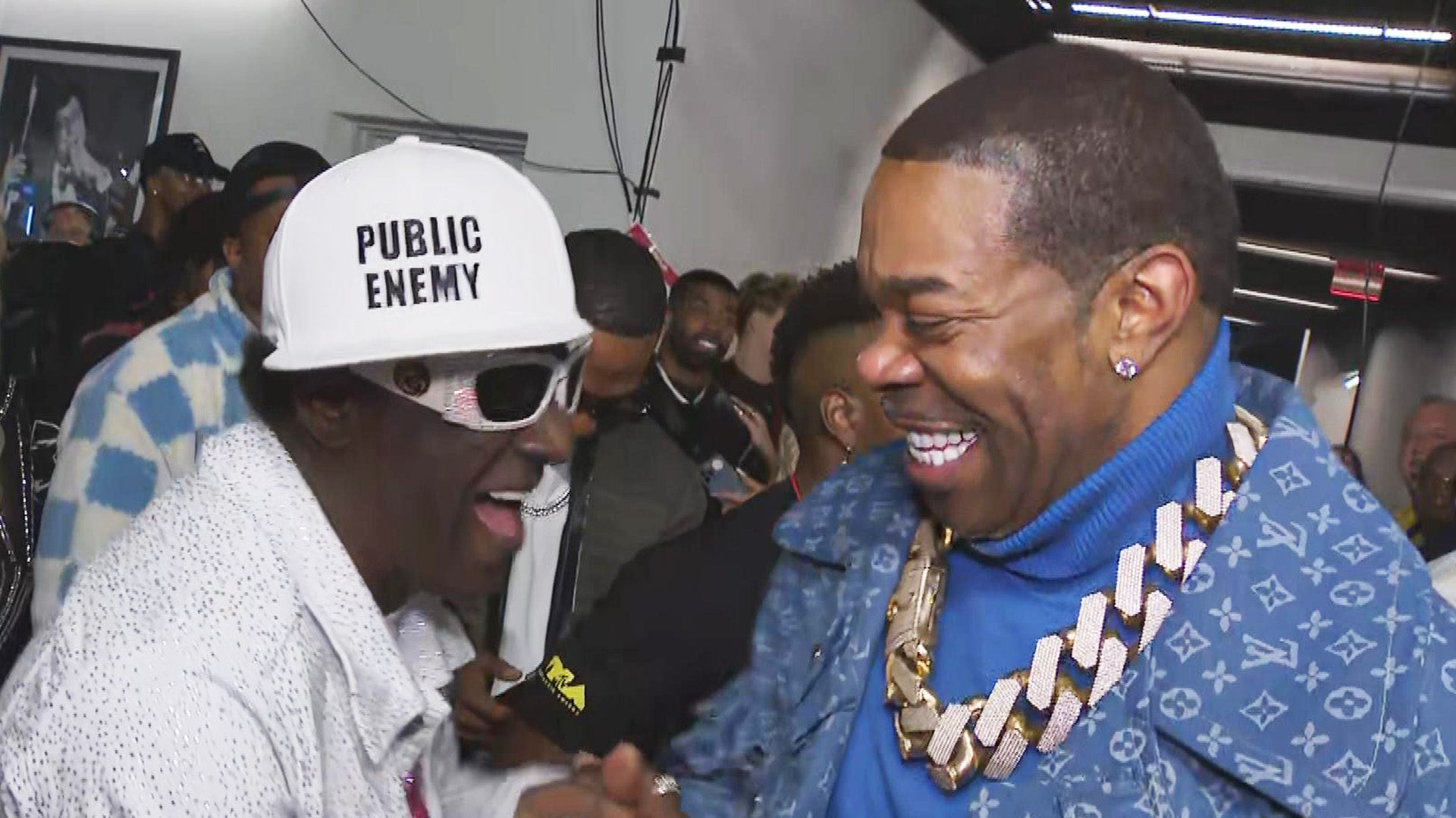 Watch Flavor Flav Lose It When He Sees 'Rap God' Busta Rhymes at VMAs Backstage (Exclusive)