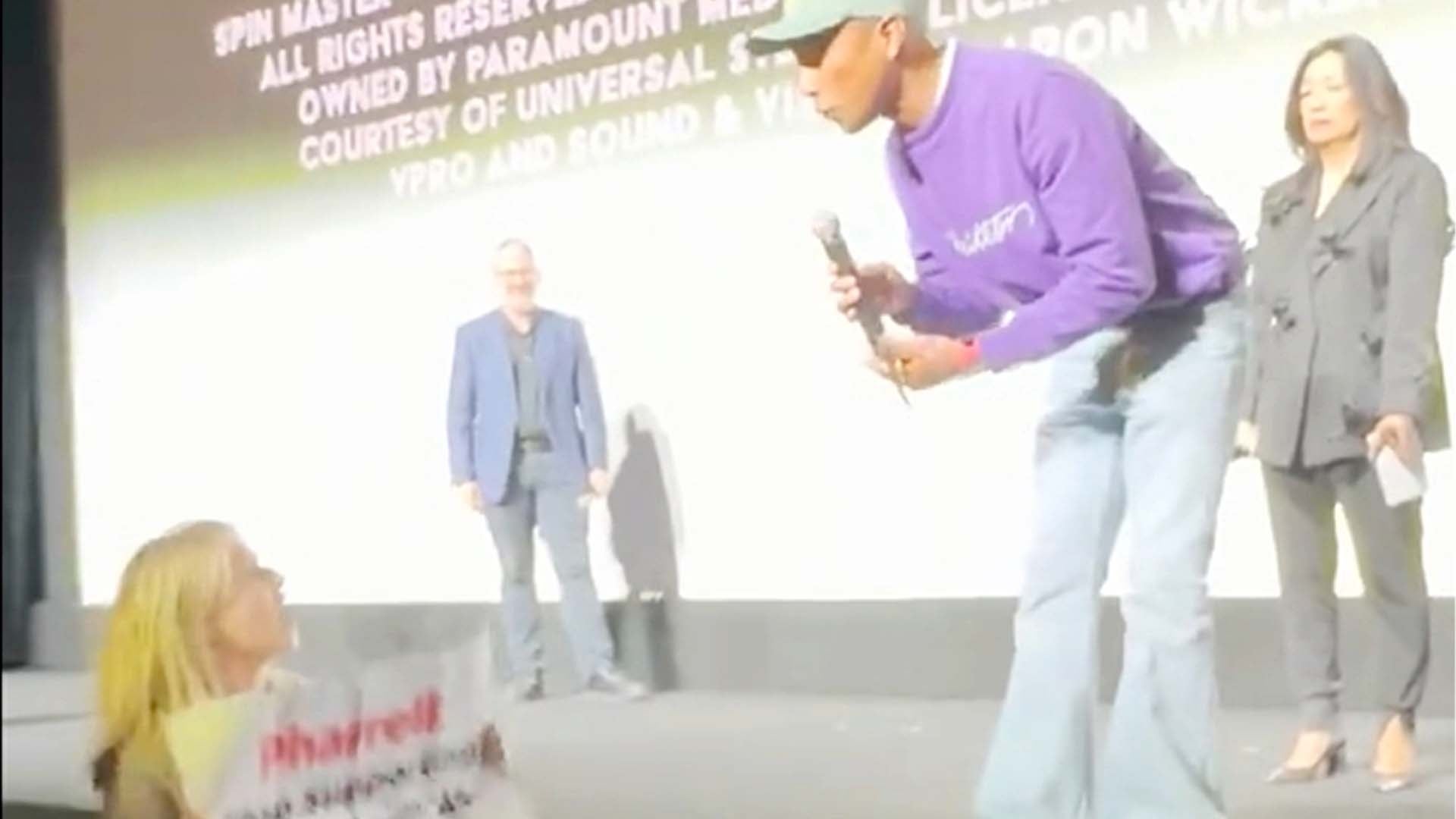 Watch Pharrell's Unexpected Reaction to PETA Protestor Rushing to the Stage